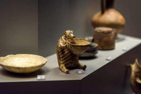 Athens - May 7, 2018: Unique zoomorphic clay vase like hedgehog in the National Archaeological Museum in Athens, Greece. Remains of famous Ancient Greek culture. Old ceramic crockery and pottery.のeditorial素材
