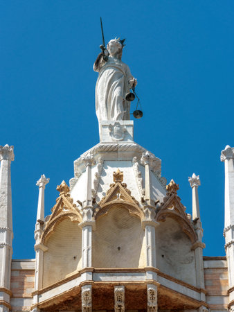 Doge`s Palace detail, Venice, Italy. Famous Palazzo Ducale is one of the top landmarks of Venice. Old statue on the Doge`s Palace roof. Ornate Renaissance architecture of Venice close-up.のeditorial素材