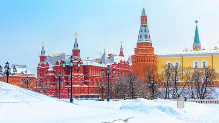 Moscow in winter, Russia. Snowy Manezhnaya Square overlooking Moscow Kremlin, top landmark of city. Panorama of Moscow center during snowfall. Scenery of old Moscow buildings under snow.のeditorial素材