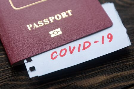 Coronavirus and travel concept. Note COVID-19 coronavirus and passport. Novel corona virus outbreak.の写真素材