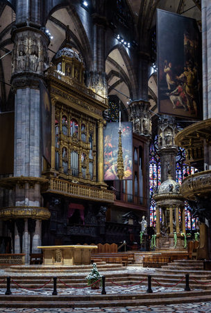 Milan, Italy - May 16, 2017: Altar and organ of Milan Cathedral or Duomo di Milano. It is great Catholic church, landmark of Milan. Inside famous Gothic cathedral, ornate interior of Christian templeのeditorial素材