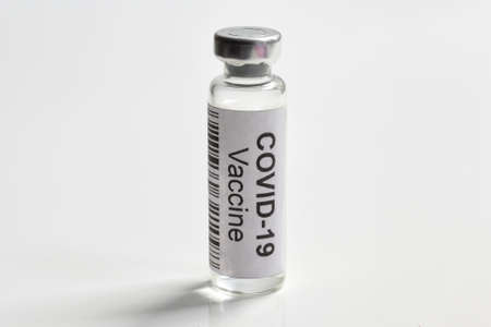 COVID-19 coronavirus vaccine on white background, bottle with vaccine for SARS-CoV-2 coronavirus...
