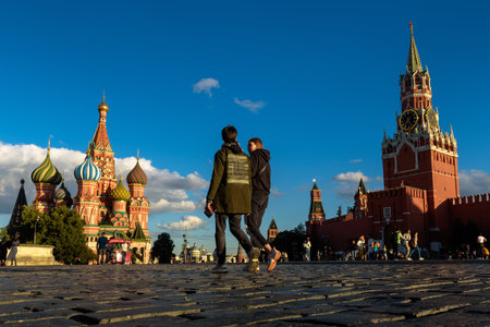 Moscow - July 23, 2020: People walk on Red Square in Moscow, Russia. Nice view of St Basil's Cathedral and Moscow Kremlin at sunset. This place is famous tourist attraction of Moscow. Travel conceptのeditorial素材