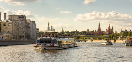 Moscow - Aug 20, 2020: Panorama of Moskva River and Kremlin in Moscow, Russia. Cityscape of Moscow center with tourist boats and ships. Travel and vacation in Moscow city in summer.のeditorial素材
