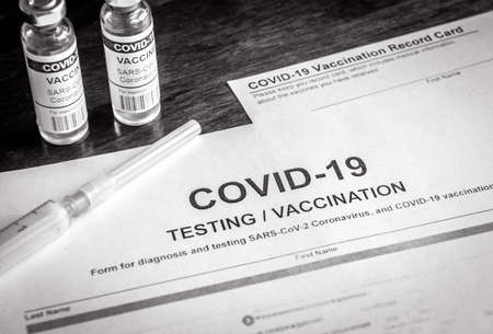 COVID-19 test and vaccine medical form in clinic. Coronavirus vaccination certificate and vaccine...
