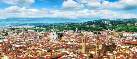 Panorama of Florence, Italy, Europe. Urban landscape of old town with houses covered red tiles. Aerial panoramic view of Florence city in summer. Beautiful Florence skyline and cityscape with blue skyの写真素材