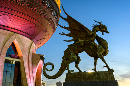 Kazan, Russia - June 18, 2021: Family center and wedding palace at night, Kazan, Tatarstan. Statue of Dragon Zilant, official symbol of Kazan close-up. This place is landmark of city. Travel concept.のeditorial素材