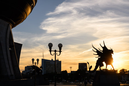 Kazan, Russia - June 18, 2021: Cityscape of Kazan at sunset, Tatarstan. Statue of Dragon Zilant, official symbol of Kazan, at Wedding palace (Family center) at night. This place is landmark of city.のeditorial素材