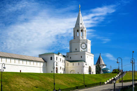 Kazan Kremlin in summer, Tatarstan, Russia. It is top landmark of Kazan. Scenery of white wall and Spasskaya Tower under blue sky. Historical architecture in old Kazan city center.の写真素材