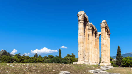 Temple of Olympian Zeus, Athens, Greece, Europe. Ancient building of Zeus is famous landmark of old Athens. Scenic panorama of classical Greek ruins in Athens city center under blue sky for background.の写真素材