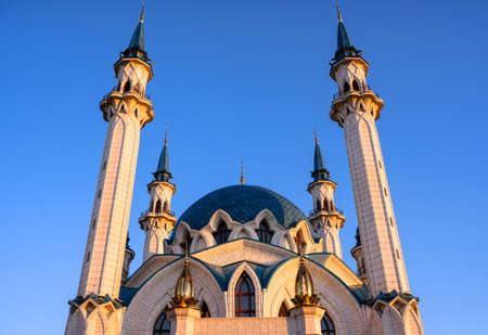 Kul Sharif mosque in Kazan Kremlin at sunset, Tatarstan, Russia. It is landmark of Kazan. Bottom view of beautiful mosque on blue sky background. Concept of Islamic architecture, faith and worship.の写真素材
