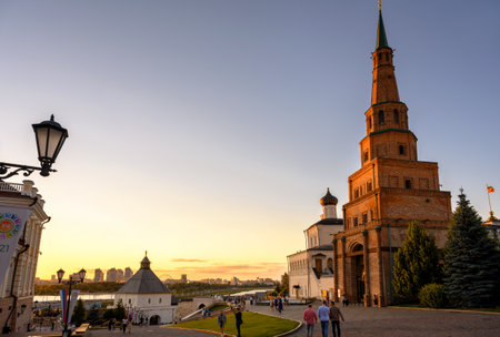 Kazan, Russia - June 17, 2021: People visit Kazan Kremlin at sunset, Tatarstan. This place is main famous tourist attraction of Kazan. Evening view of old landmarks in Kazan city center in summer.のeditorial素材