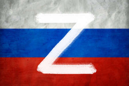 Letter Z on Russian flag background, military symbol of Russia used in Russia-Ukraine war. Painted...