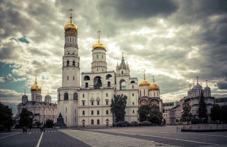 Russian cathedrals and churches at Moscow Kremlin, Russia. Scenery of old Orthodox temples of Moscow, dramatic view of historical landmarks in Moscow city center. Tourism and travel in Russia theme.の写真素材