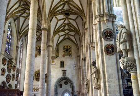 Ulm, Germany - Jul 20, 2019: Ornate interior of old Ulm Cathedral or Minster, Baden-Wurttemberg. It is medieval German church, top landmark of Ulm. Inside luxury Protestant Gothic cathedral.のeditorial素材