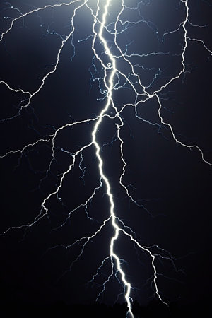 Lightning bolt in dark blue sky, vertical view of electric flash light in storm on black background. Concept of thunderbolt, thunderstorm, strike, nature, charge. Generative AIの素材