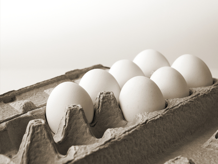 7 Chicken eggs that are fresh in a cardboard package made of recycled waste paper and ready for...