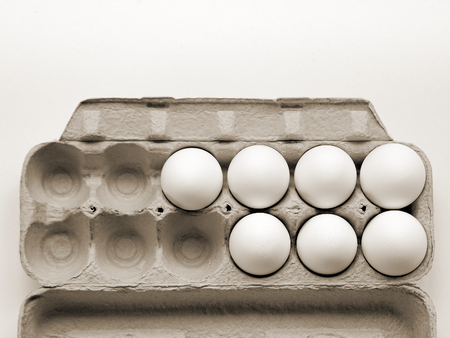 7 Chicken eggs that are fresh in a cardboard package made of recycled waste paper and ready for...