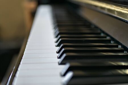 Piano keys close up with black and white keyboard and shallow depth of field.の写真素材
