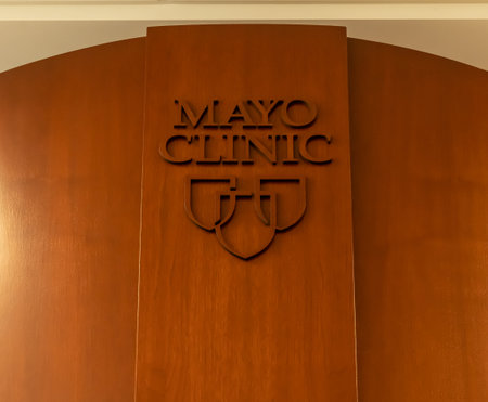 ROCHESTER, MN - 25 JUL 2020: A wooden sign with corporate name and logo on a wall. Mayo Clinic is an Ameridcan nonprofit academic medical center which originated in Rochester, Minnesota.のeditorial素材