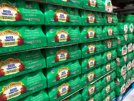 BAXTER, MN - 3 FEB 2021: Tuttorosso Diced Tomatoes with basil, garlic and oregano on display and for sale in a retail store. Eight cans in each pack.のeditorial素材