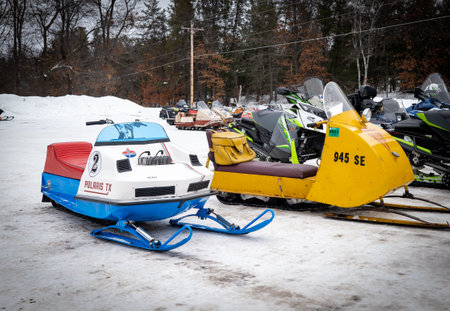 NISSWA, MN - 21 JAN 2022: 1970s Polaris TX and Bombardier SkiDoo on snow.のeditorial素材