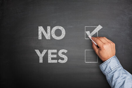 Yes or No, two choices written on the blackboardの写真素材