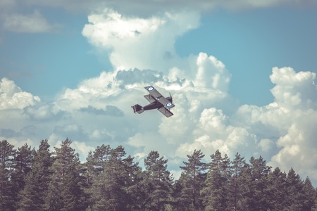 World War II airplane on cloudy skyの写真素材