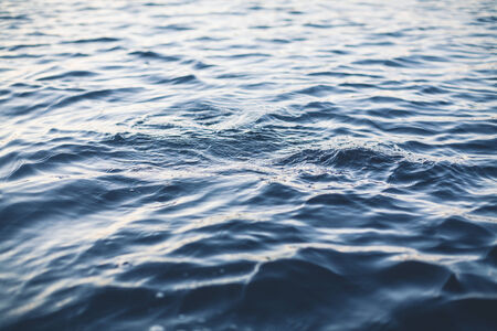 Finnish lake surface on summer blue water
