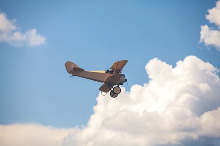 World War II airplane on cloudy skyの写真素材