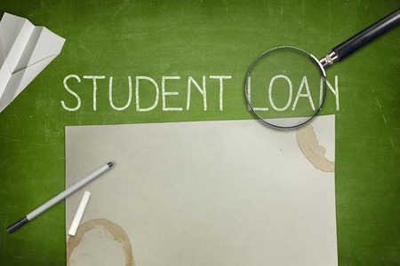 Student loan concept on blackboard with penの写真素材