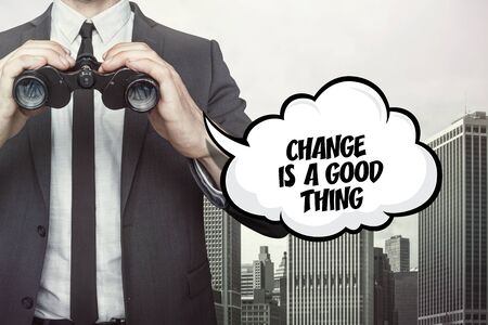 Change is a good thing text on cloud with businessman and Binocularsの写真素材