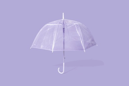 Purple umbrella on purple backgroundの写真素材