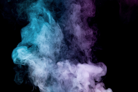 Colorful smoke on black backgroundの写真素材