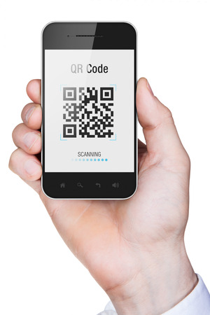 Businessman hand holding a mobile phone with qr code on screen