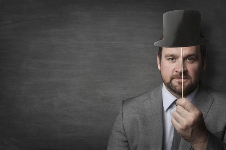 Businessman wearing old school vintage cylinder hatの写真素材