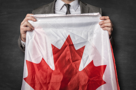Businessman with Canada flagの写真素材