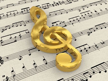 Golden treble clef on score paperの写真素材