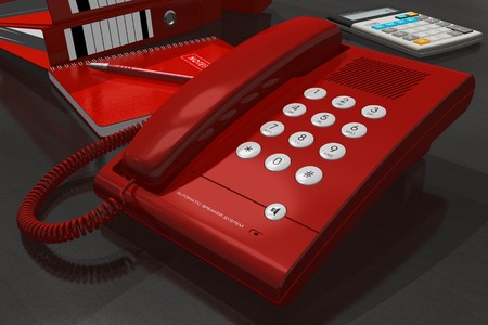 Red phone on office tableの写真素材