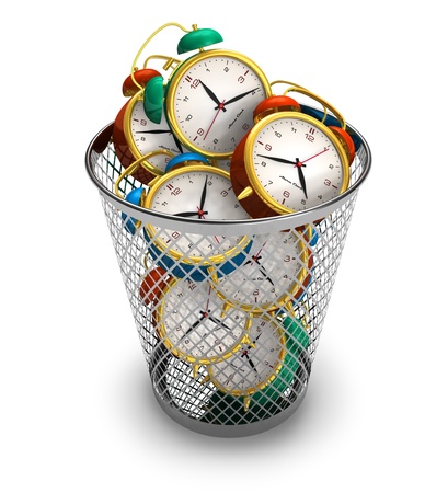 Wasting time concept: alarm clocks in the trash bin Wasting time concept: alarm clocks in the trash bin
