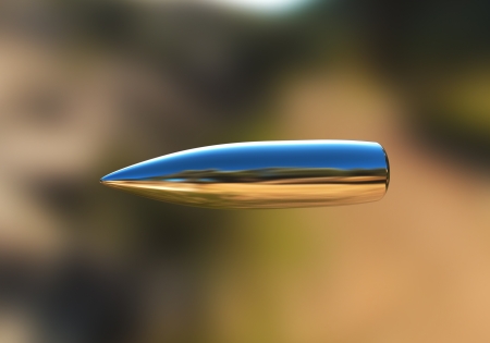 Macro shot of silver bullet caught in flight