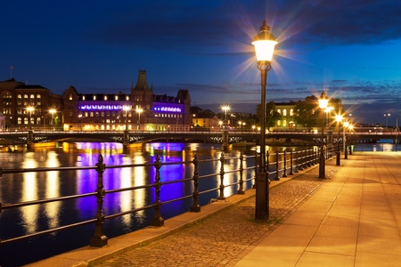 Scenic night view of the Old Town (Gamla Stan) in Stockholm, Sweden *** NOTE: TEXT LABEL ON BUILDING IS ITS ANCIENT, HISTORICAL AND INHERENT NAMEの写真素材