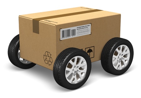 Shipping, logistics and delivery concept: cardboard box with car wheels isolated on white background. All text labels, numbers and barcodes are fully abstractの写真素材