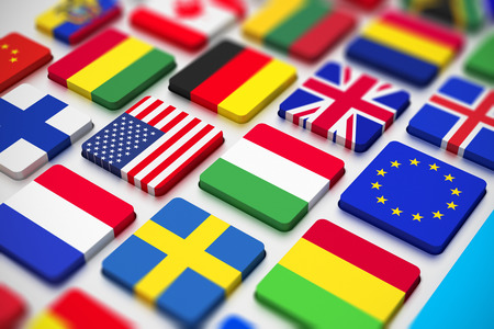 Creative abstract business, international communication and cartography technology corporate office concept  close macro view of computer PC keyboard from colorful world countries flags with selective focus effectの写真素材