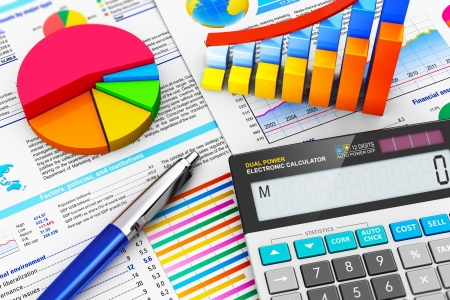 macro view of office electronic calculator, bar graph charts, pie diagram and ballpoint pen on financial reports with colorful data with selective focus effectの写真素材
