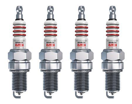 set of four metal spark plugs isolated on white backgroundの写真素材
