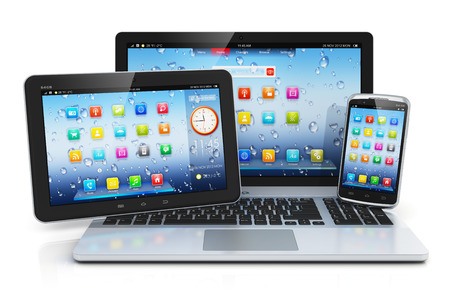 Mobile devices, mobility and telecommunication concept  metal business laptop or office notebook, tablet PC computer and modern black glossy touchscreen smartphone with colorful interface with application icons isolated on white background with reflectionの写真素材