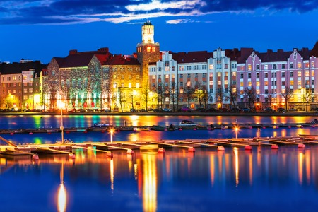 Scenic night panorama of sea pier illuminated architecture in Hakaniemi district in Helsinki, Finlandの写真素材