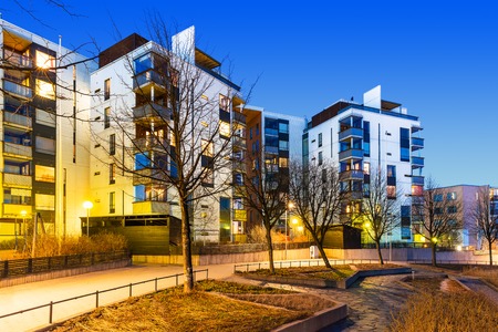 House building and city construction concept  evening outdoor urban view of modern real estate homesの写真素材