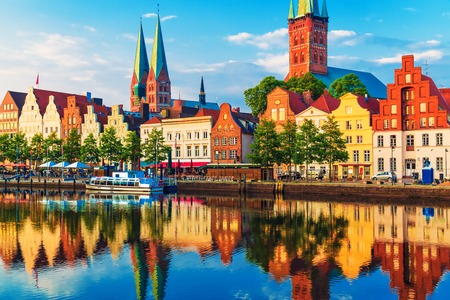 Scenic summer sunset view of the Old Town pier architecture in Lubeck, Germanyの写真素材